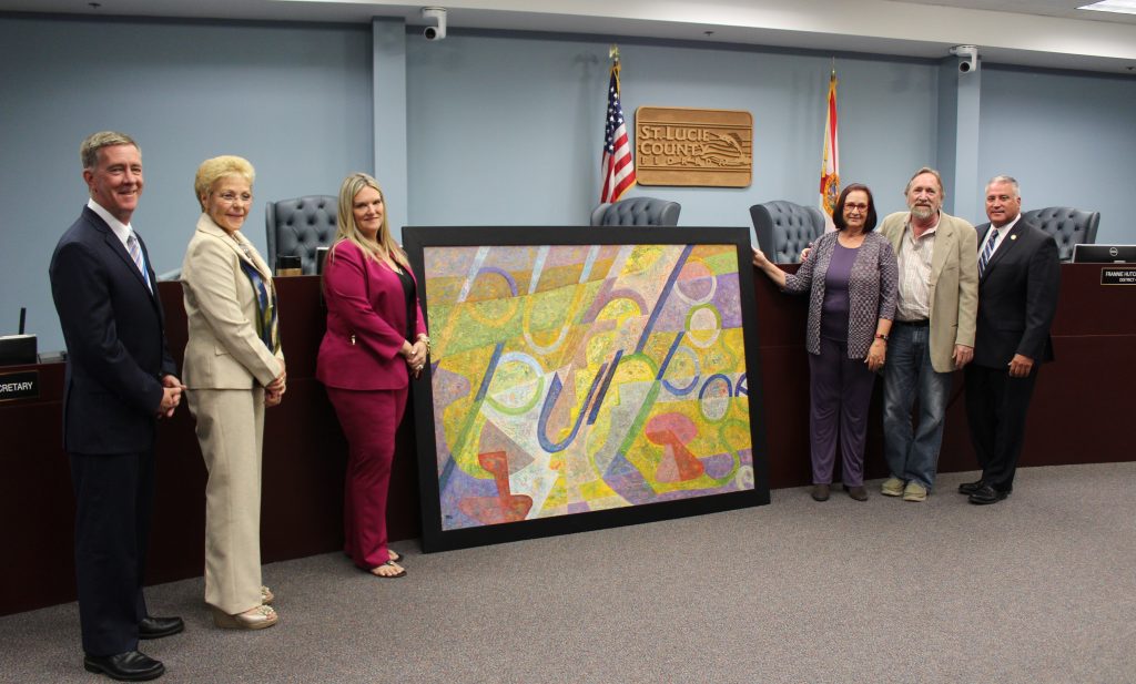 Glenn Ryals, St. Lucie County artist, donates a painting to St. Lucie County to celebrate St. Lucie Cultural Alliance being designated as official local arts agency. 